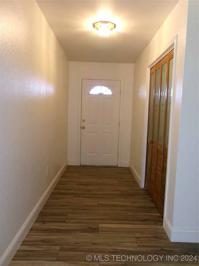 doorway with dark hardwood / wood-style flooring