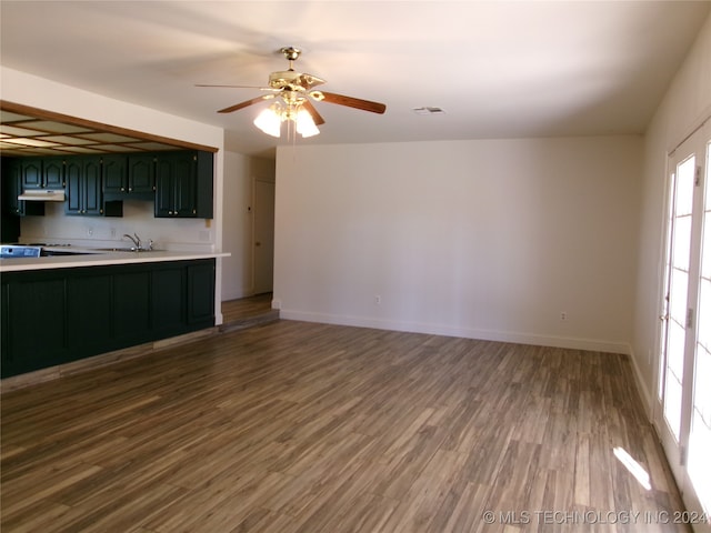 kitchen featuring range, ceiling fan, hardwood / wood-style floors, and sink