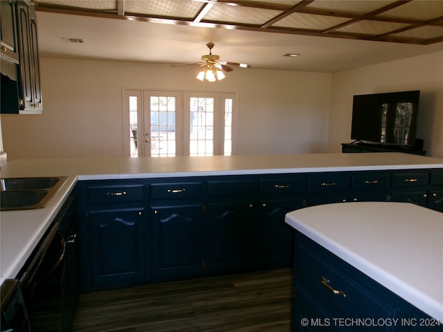 kitchen featuring dark wood-type flooring, sink, ceiling fan, blue cabinetry, and black dishwasher