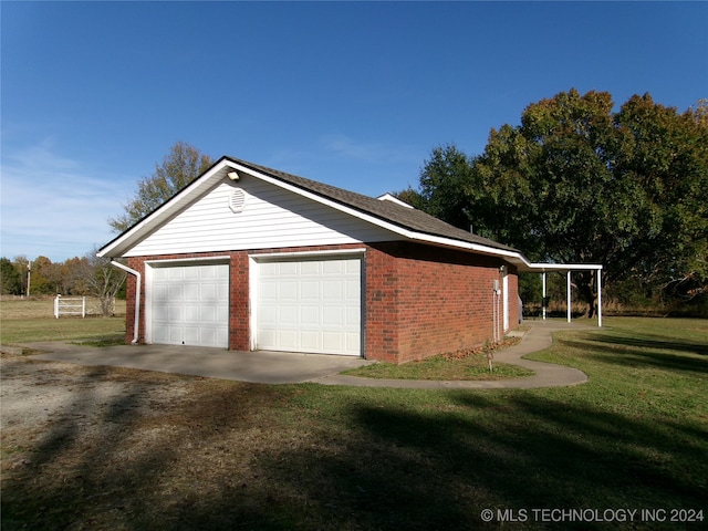 garage with a yard