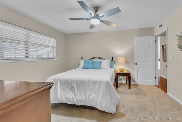 carpeted bedroom featuring ceiling fan