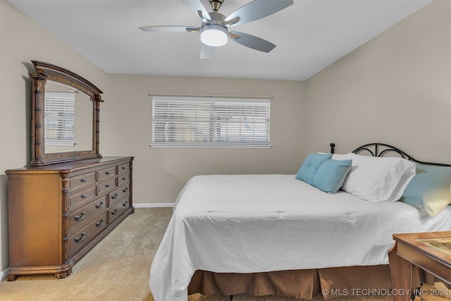 bedroom featuring ceiling fan and light colored carpet