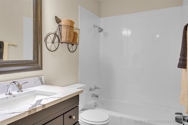 full bathroom featuring vanity, toilet, and tiled shower / bath combo