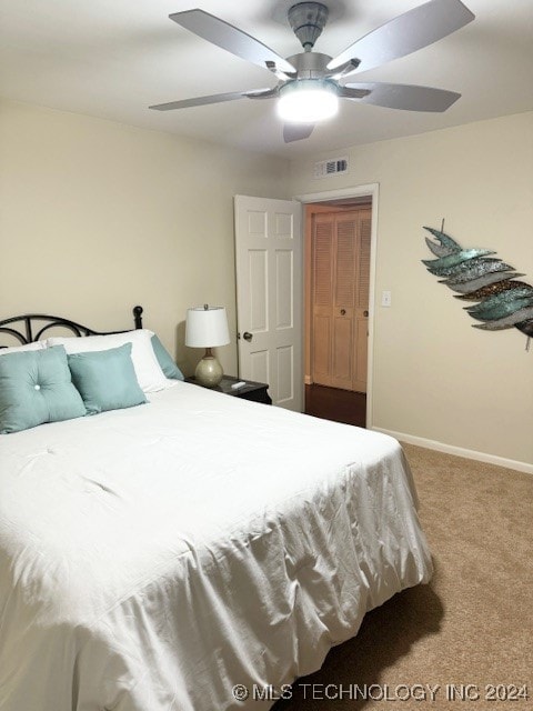 carpeted bedroom with ceiling fan