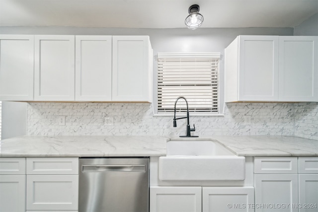 kitchen featuring dishwasher, sink, light stone counters, decorative backsplash, and white cabinets