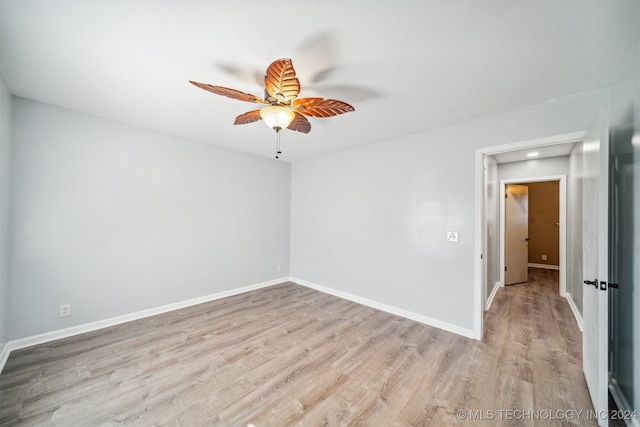 empty room with light wood-type flooring and ceiling fan