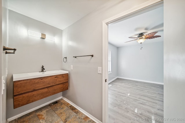 bathroom with vanity, hardwood / wood-style flooring, and ceiling fan