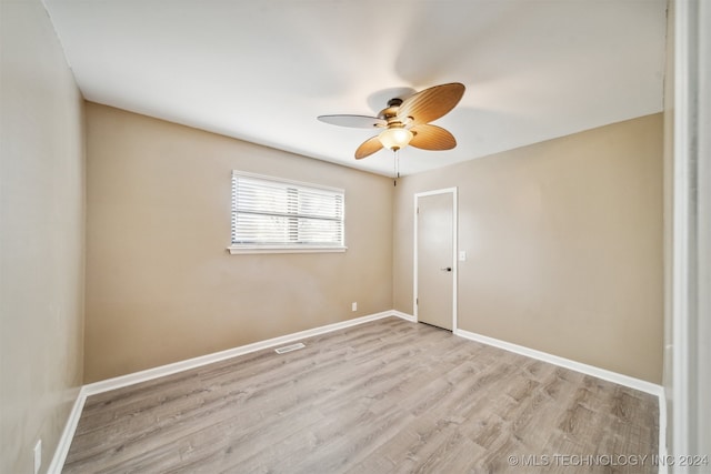 spare room with ceiling fan and light hardwood / wood-style floors