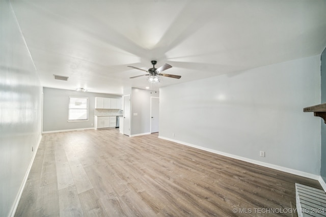 unfurnished living room featuring light wood-type flooring and ceiling fan