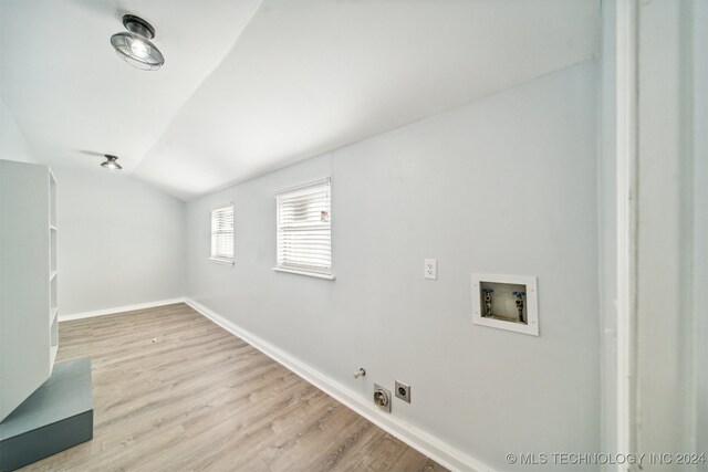 laundry area with washer hookup, hookup for a gas dryer, hookup for an electric dryer, and light hardwood / wood-style flooring