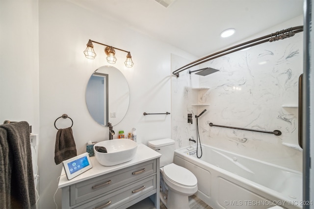 full bathroom with toilet, vanity, and washtub / shower combination