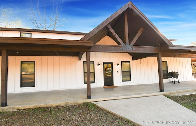 entrance to property featuring a patio