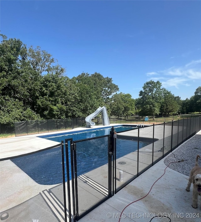 view of pool featuring a water slide