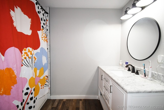 bathroom with vanity and wood-type flooring