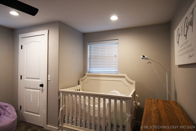 bedroom featuring a crib