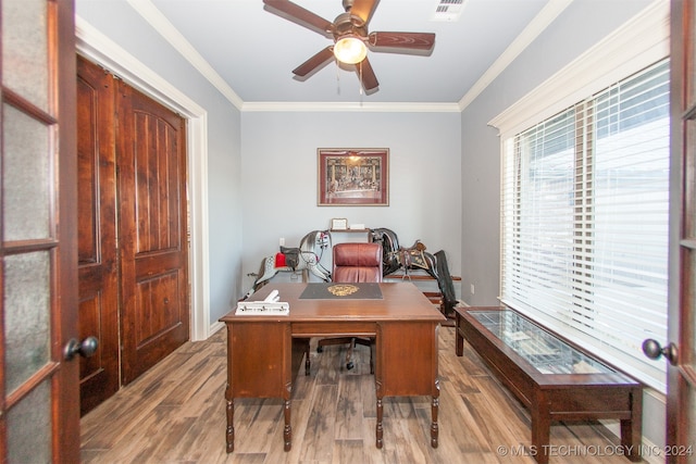 office with ceiling fan, ornamental molding, and light hardwood / wood-style flooring