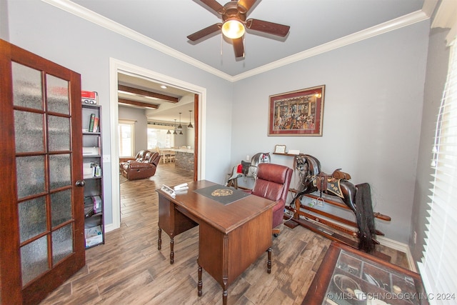 office space with beamed ceiling, ceiling fan, wood-type flooring, and crown molding