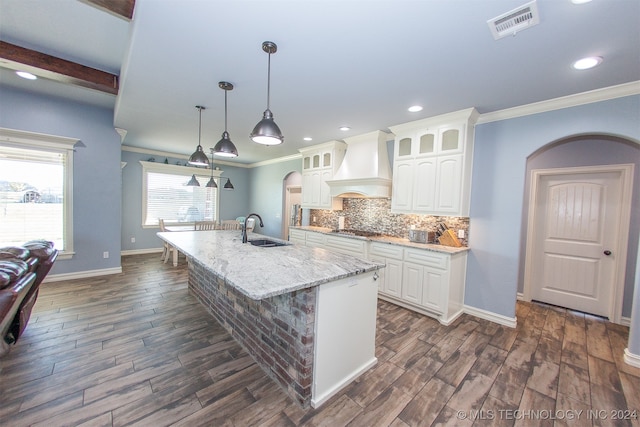 kitchen featuring premium range hood, sink, white cabinets, and dark hardwood / wood-style floors