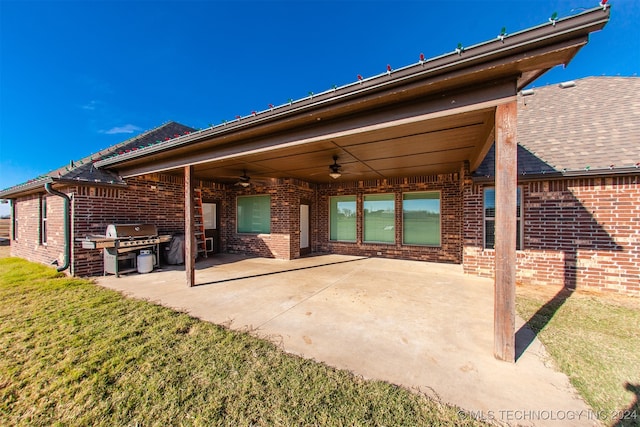 view of patio with ceiling fan and a grill