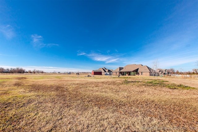 view of yard with a rural view