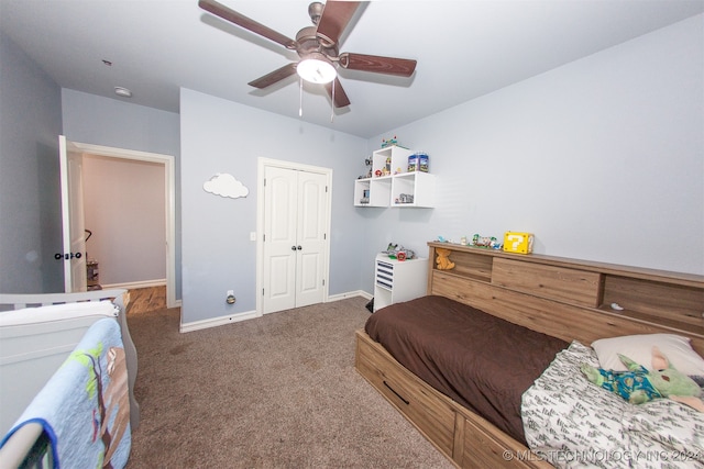 carpeted bedroom featuring ceiling fan and a closet