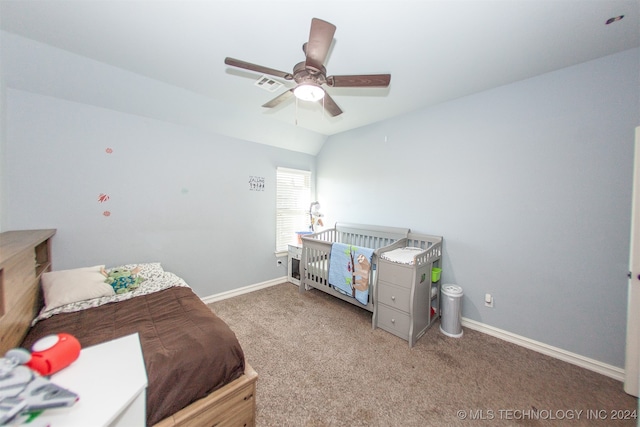 carpeted bedroom with ceiling fan and lofted ceiling