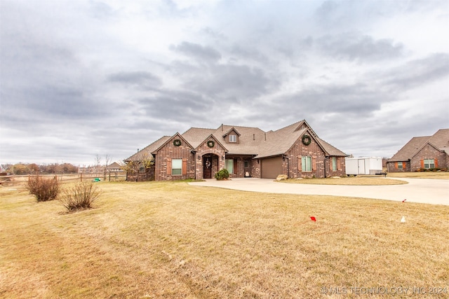 view of front of property with a garage and a front yard