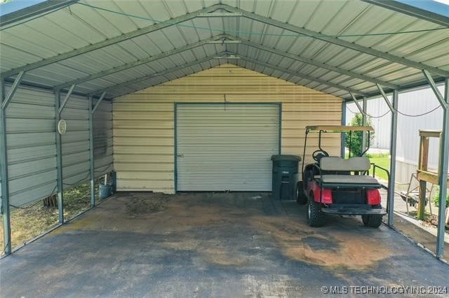 garage featuring a carport