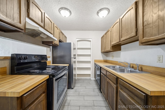 kitchen with butcher block counters, electric range oven, a sink, dishwasher, and under cabinet range hood