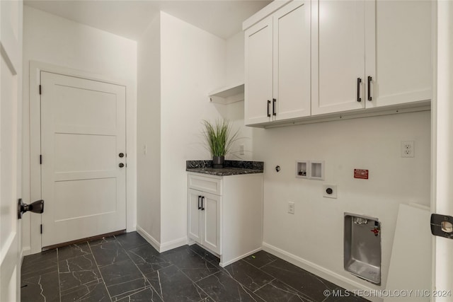 washroom with hookup for an electric dryer, washer hookup, gas dryer hookup, and cabinets