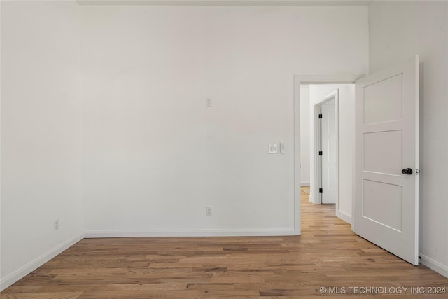 unfurnished room with light hardwood / wood-style flooring