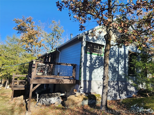 view of home's exterior with a deck