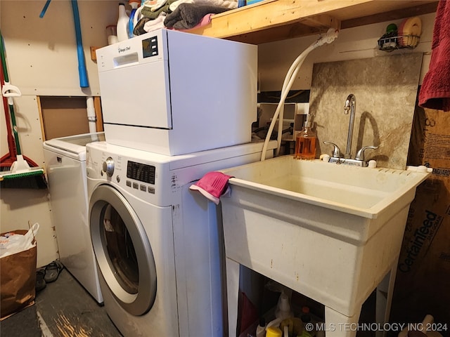 laundry area featuring stacked washing maching and dryer