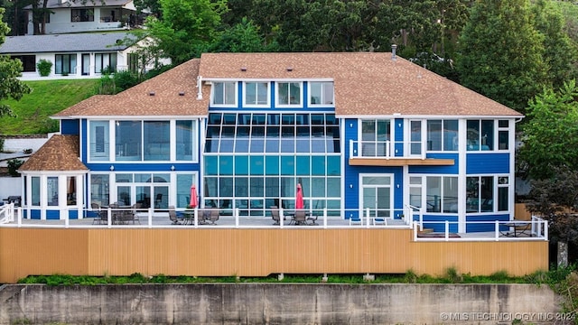 back of property with a patio and a balcony