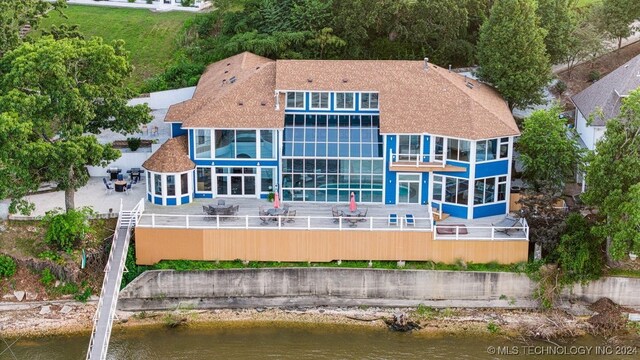 back of house with a water view