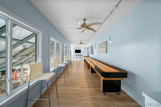 playroom featuring light hardwood / wood-style floors and ceiling fan