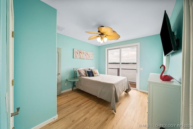 bedroom with ceiling fan, access to outside, and light hardwood / wood-style flooring