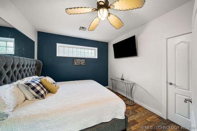 bedroom featuring ceiling fan and dark hardwood / wood-style flooring