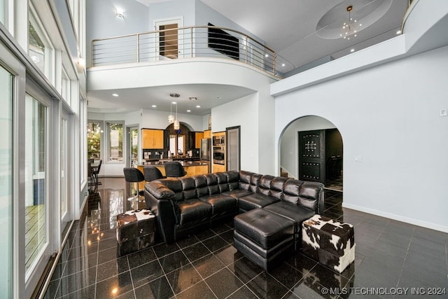 living room featuring a high ceiling