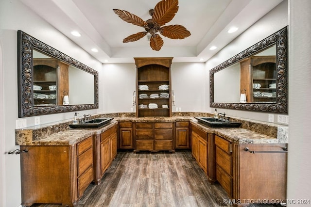 bathroom featuring ceiling fan, vanity, and wood-type flooring