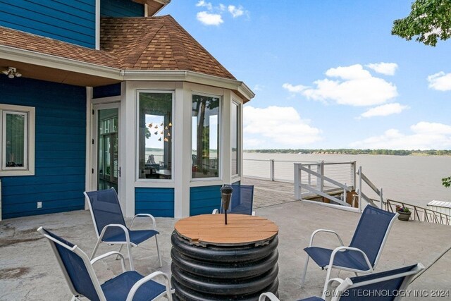 view of patio / terrace with a water view