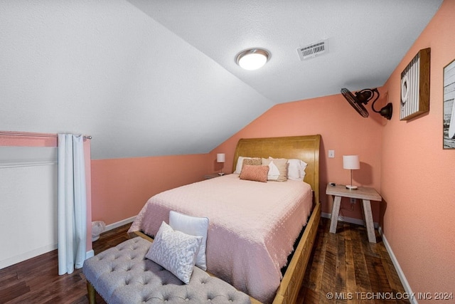 bedroom with dark hardwood / wood-style flooring and vaulted ceiling