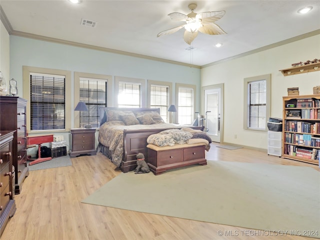 bedroom with light wood-type flooring, ceiling fan, and ornamental molding