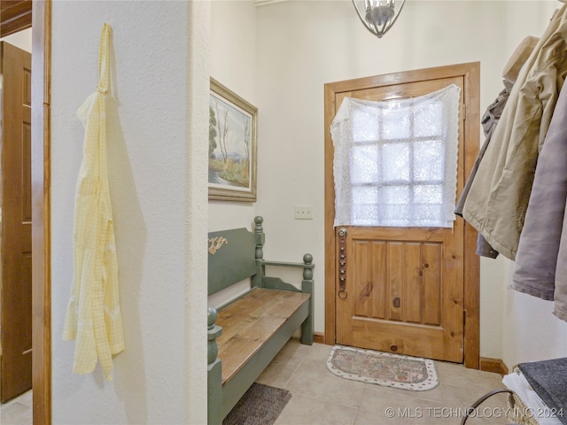 entryway with light tile patterned floors