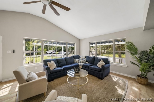 living room featuring light wood-type flooring, vaulted ceiling, and ceiling fan