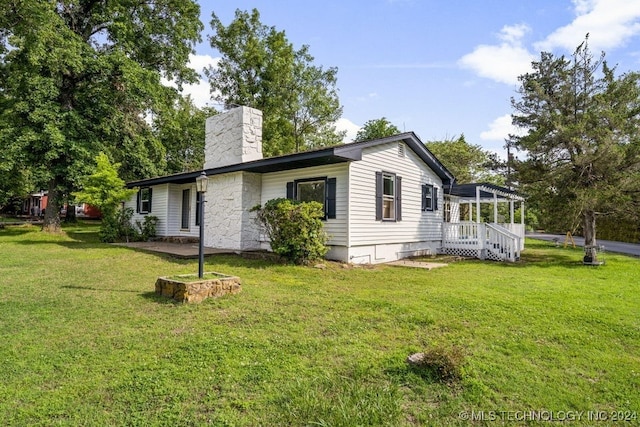 view of home's exterior with a yard