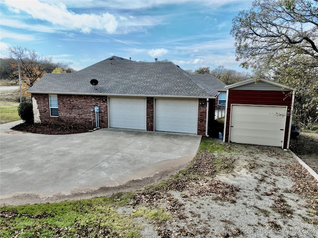 view of side of property with a garage