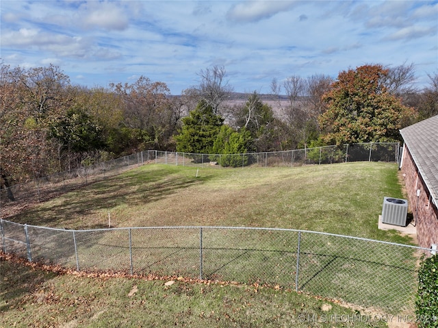 view of yard with central AC