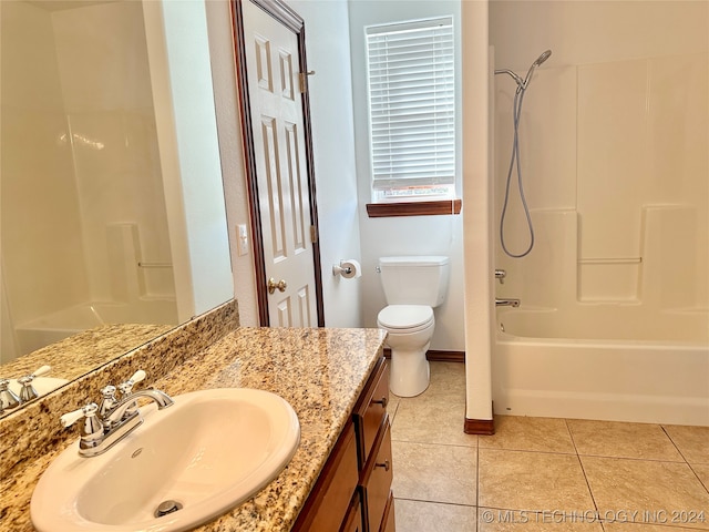 full bathroom with tile patterned floors, vanity,  shower combination, and toilet