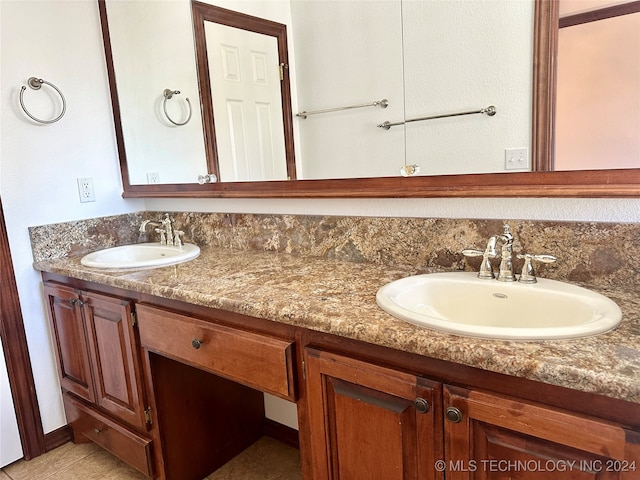 bathroom with tile patterned flooring and vanity